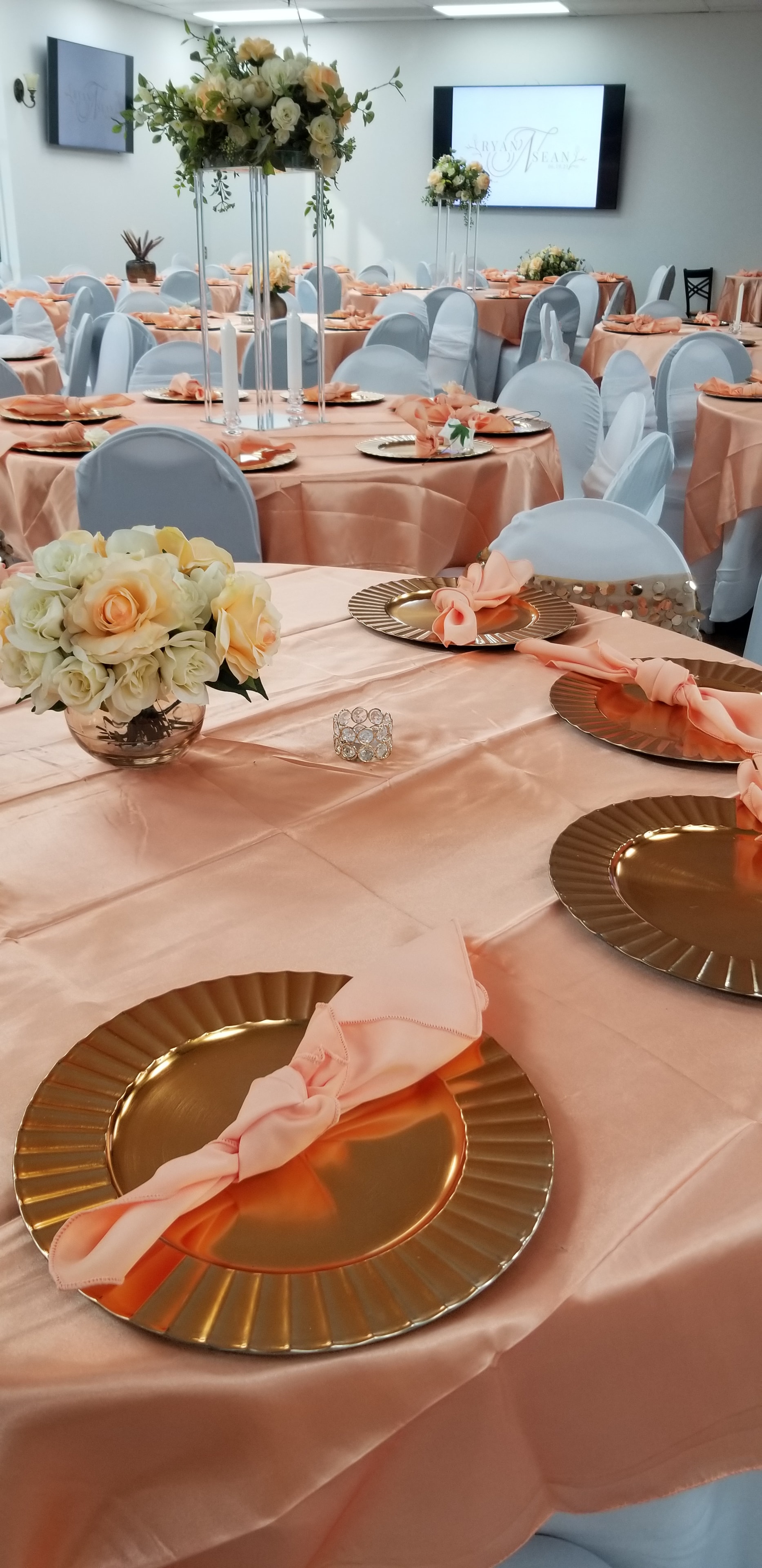 Peach and gray reception table setup at Deja Vu Event Space